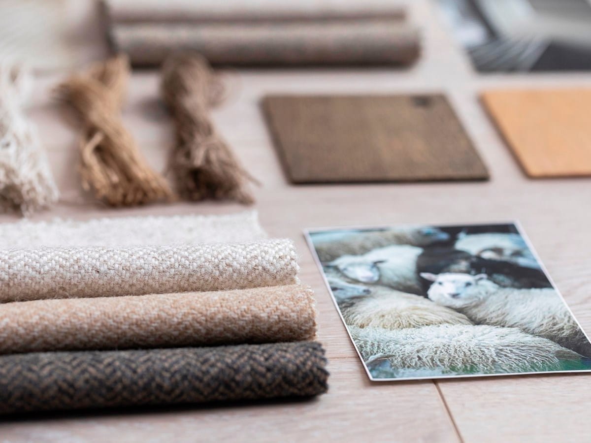 Fabric swatches and material samples laid out on a table
