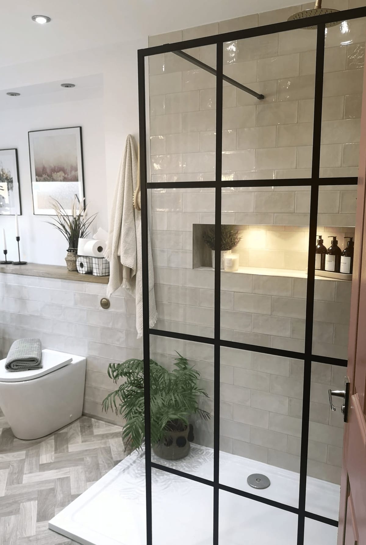 Shower room with a Crittall-style screen and lit niche